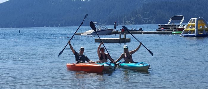 Designer Decal employees in kayaks