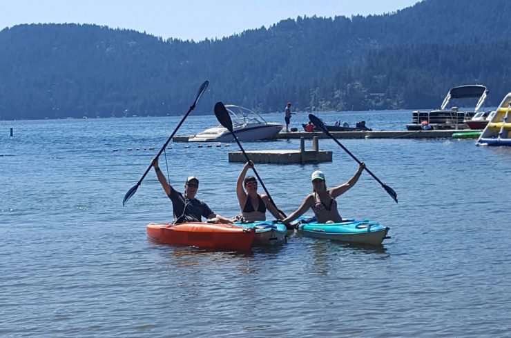 Designer Decal employees in kayaks